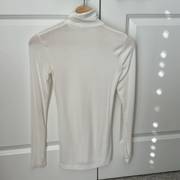 White ribbed turtleneck sweater. A bit sheer but great for layering. - Picture 3 of 4